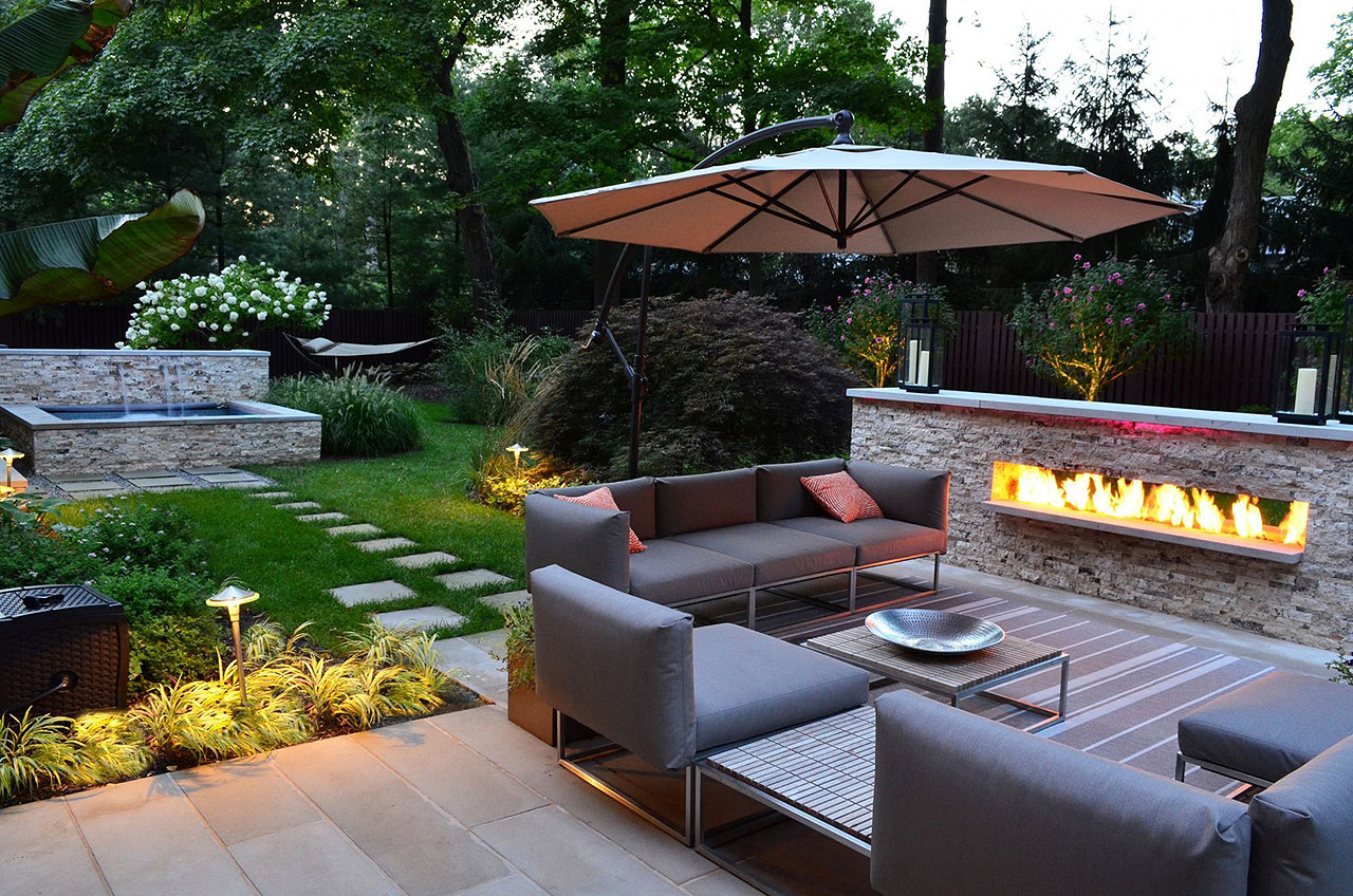 Modern-Backyard-Awesome-Small-Garden-Design-Water-Feature-Sofa-Fireplace