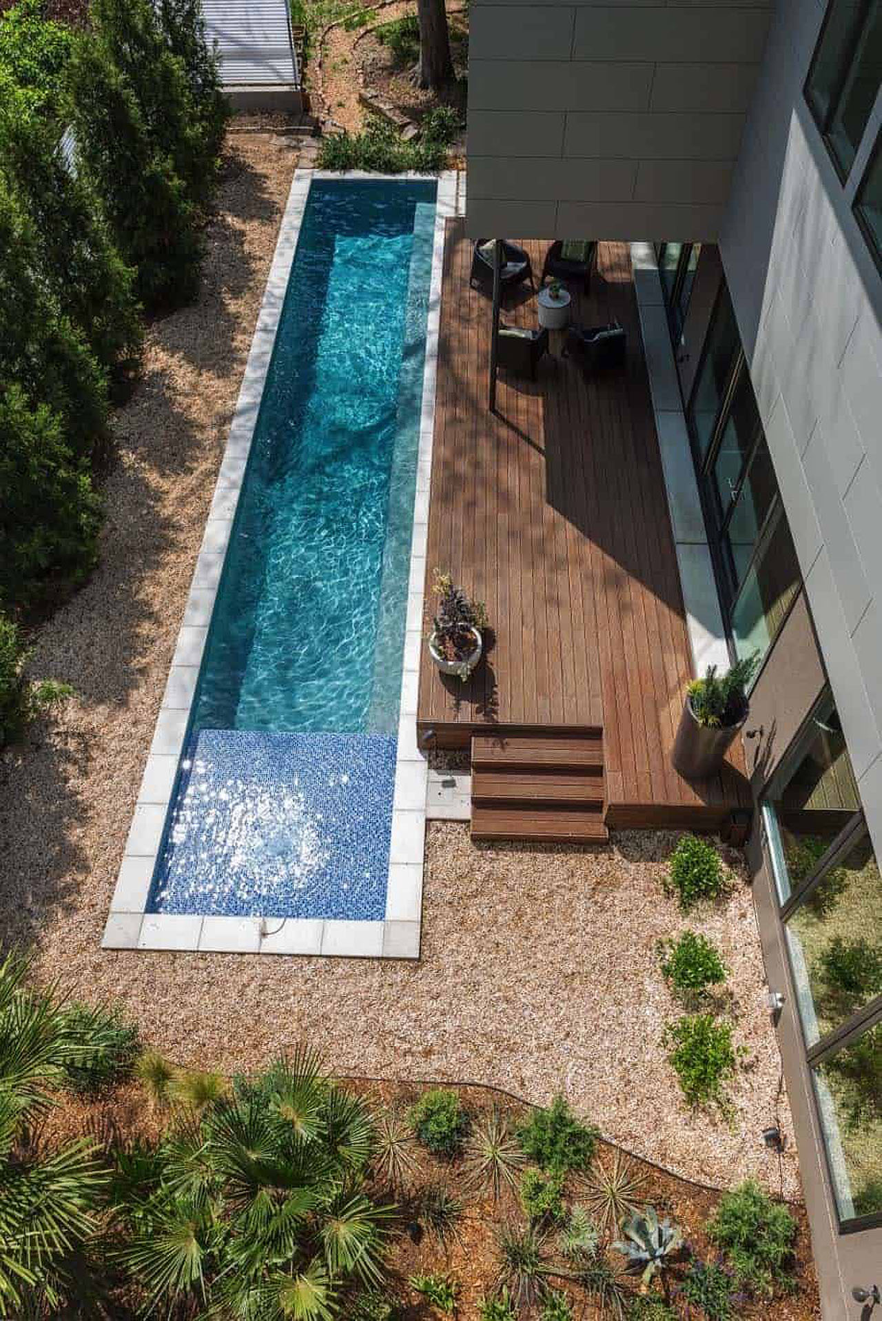 Modern-Outdoor-Patio-Design-Narrow-Pool-Wooden-Deck-landscaped-garden