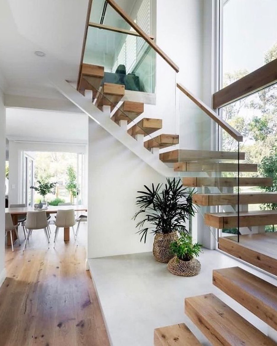 Hidden steel frame wooden floating glass balustrade