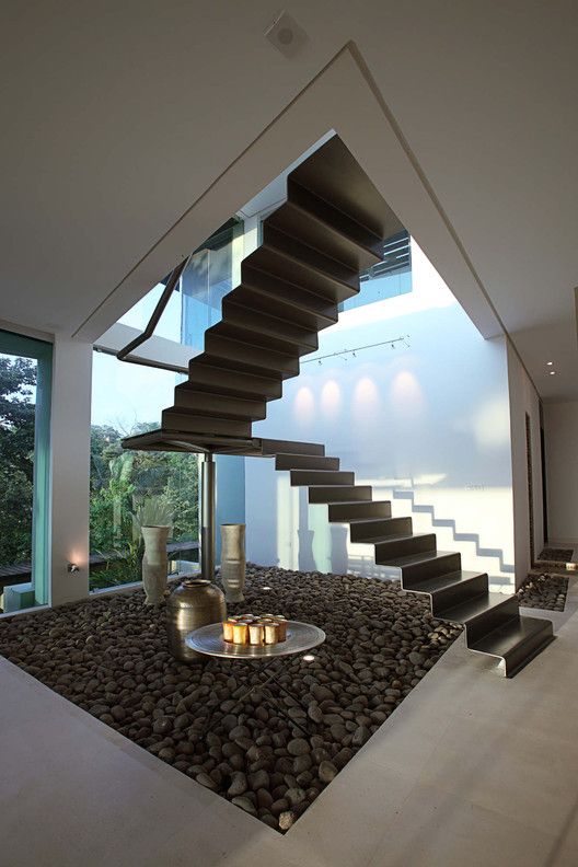 Fully open standalone folded metal staircase posted by archdaily