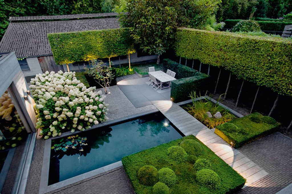 Modern-Backyard-Landscape-High-Fence-Seating-Pond-Design