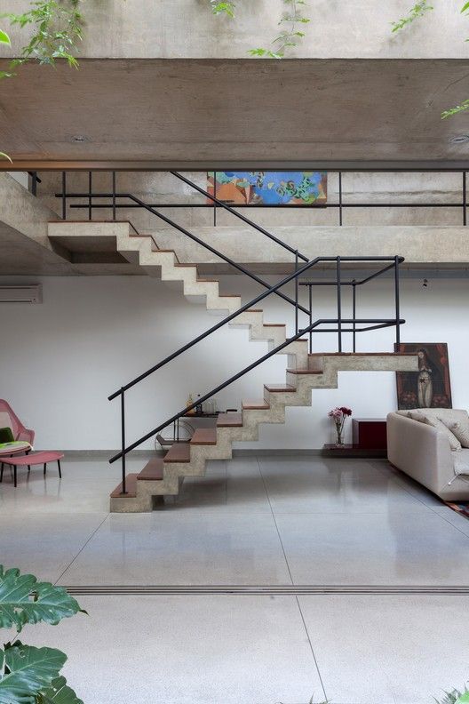 Standalone concrete floating staircase posted by archdaily