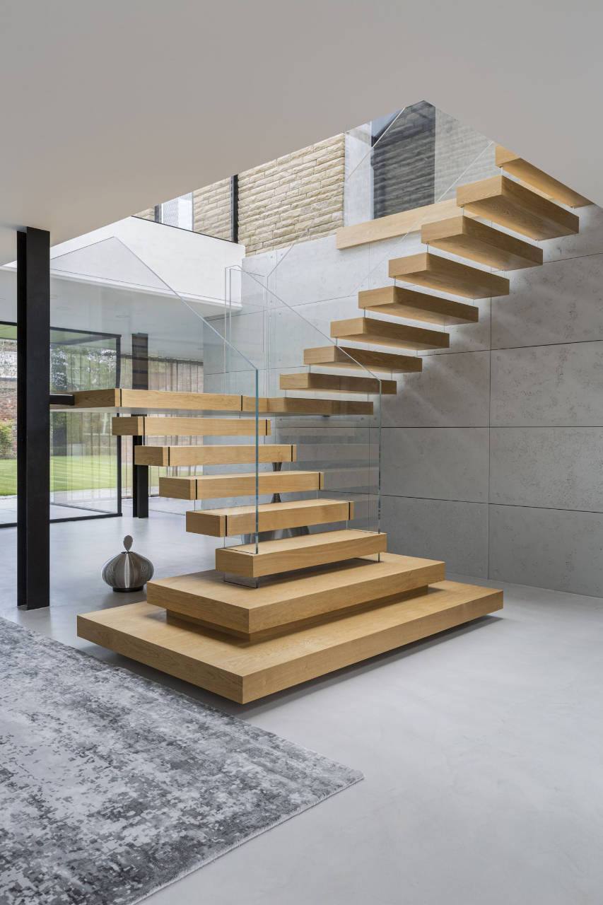 Wood and glass floating staircase posted by Dezeen