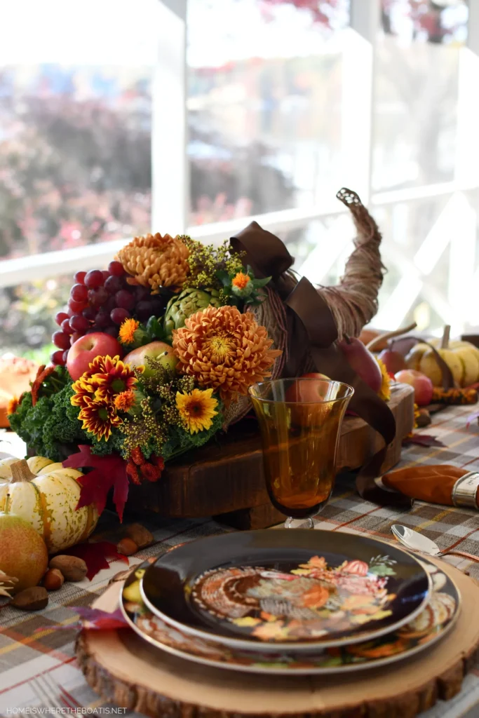 Cornucopia of flowers and fruit as table centerpiece