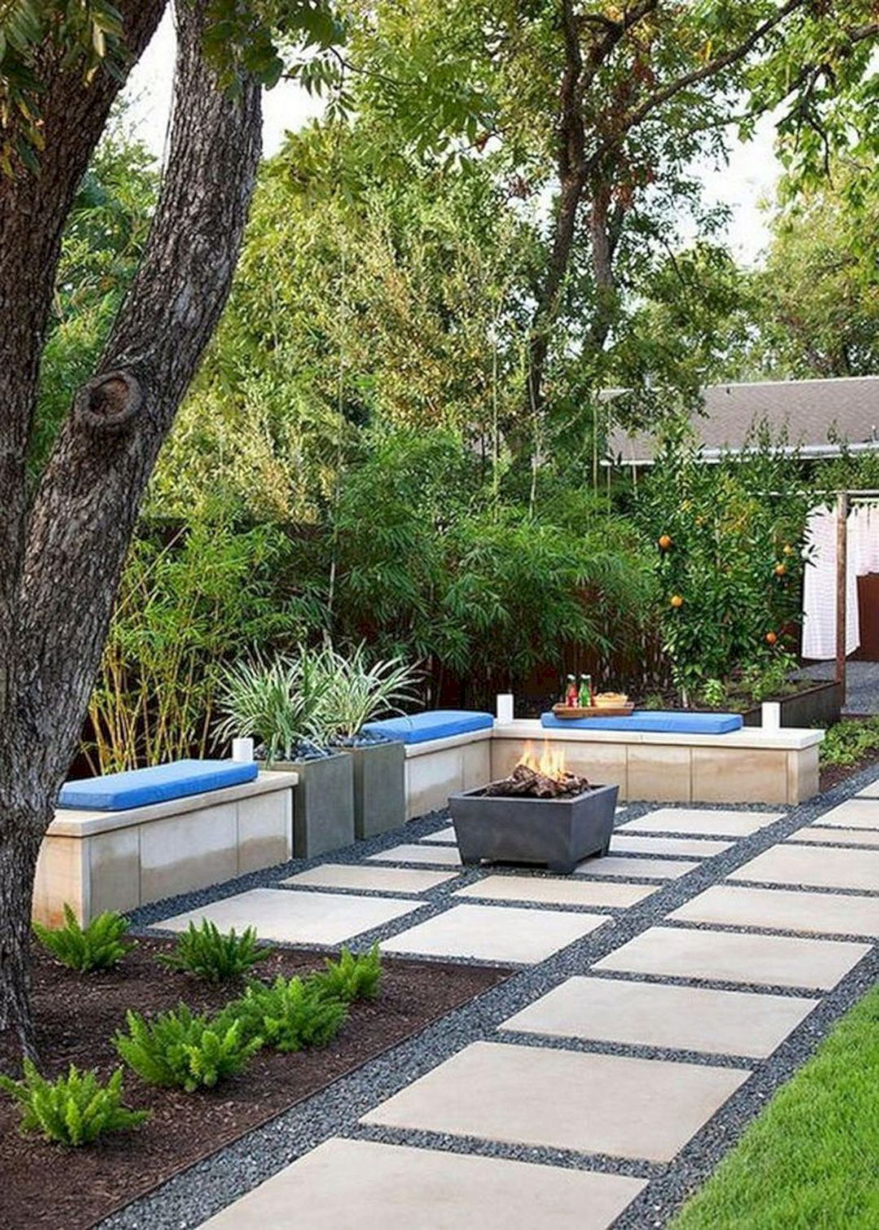 Modern-Backyard-Landscaping-Ideas-bench-seating-fireplace