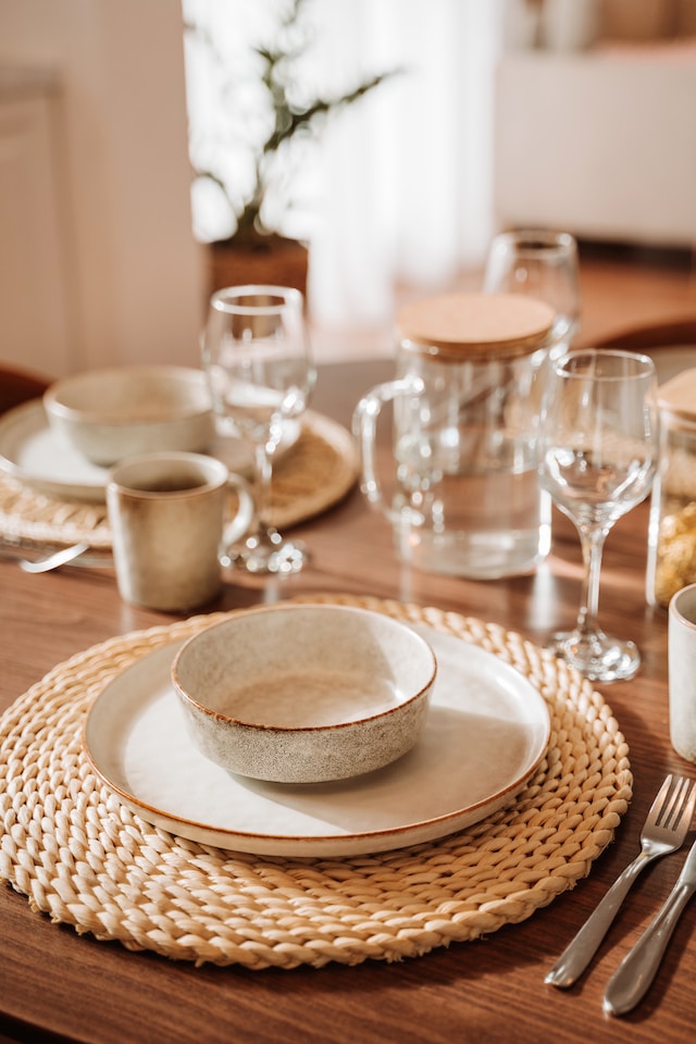 Table setting with layered plates, glasses