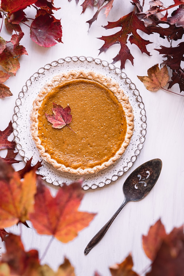 Pumpkin pie and maple leaves