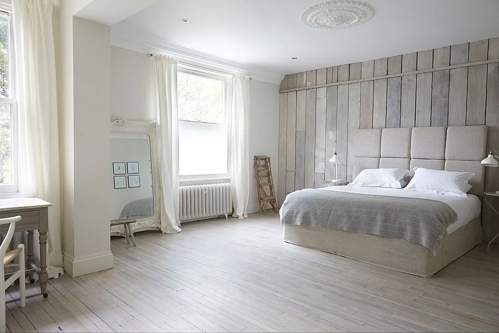 Tranquil-bedroom-in-white-uses-reclaimed-wood-all-around