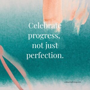 Image: Pale orange patches on top right and bottom left with a dark blue-green background. Text: Celebrate progress, not just perfection.