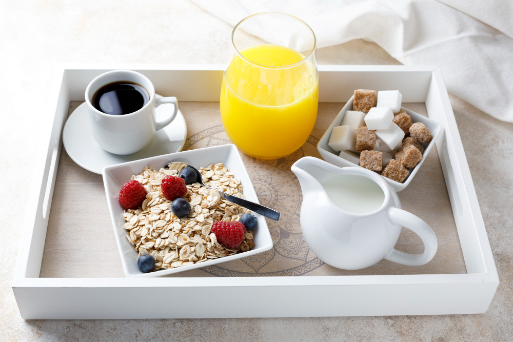 Healthy breakfast with juice and coffee on a tray